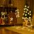 Christmas LED string lights with reindeer, star, bell, and Christmas tree shapes in a festive room setting.