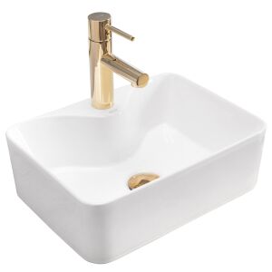 3/4 view of Rea Kelly mini ceramic washbasin with gold faucet - Washbasin