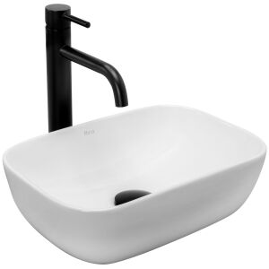 Angled view of Rea Belinda mini countertop washbasin with black faucet - Washbasin