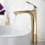 Rea Orbit High Gold Bathroom Faucet in Use