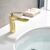 Rea Orbit Low Gold Faucet Installed in Bathroom Setting
