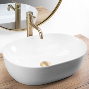 Angled view of Rea Lisa oval countertop washbasin with gold faucet - Rea