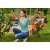 Woman using Black+Decker BCPP18D1 cordless pruning shears in garden