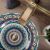 Close-up of Rea Aztec hand-painted washbasin with faucet