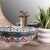 Rea Aztec hand-painted countertop washbasin with faucet in bathroom setting