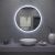 Illuminated LED Round Mirror above bathroom sink