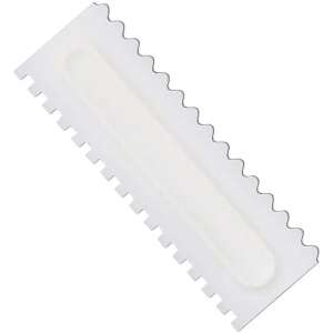 White plastic cake decorating comb spatula, used for creating decorative patterns on cakes and pastries - Spatula