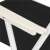 Springos folding chair, black, white frame, close-up of armrest