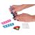 Girl's DIY nail art pen in use, applying glitter nail polish, with toe separators and nail stickers