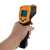 Hand holding infrared thermometer, non-contact temperature measurement, black and yellow