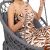 Close-up of woman in Springos grey macrame hanging chair