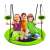 Three children sitting on the green and black nest swing, smiling and giving thumbs up