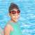 Child wearing Bestway 21005 red swimming goggles by the pool