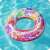Bestway 91cm inflatable swim ring with colorful mandala design, two handles, floating in a pool