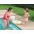 Child holding Bestway inflatable unicorn swim ring in pool