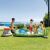 Intex Jurassic Park Inflatable Play Center in use, kids playing in the pool