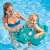 Child using INTEX inflatable crocodile swim ring in pool