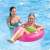 Girl using Intex 76 cm pink inflatable swim ring with handles in a pool