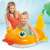 Child playing with Intex inflatable goldfish ride-on pool toy in a pool