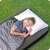 Person sleeping on a Bestway single air mattress, 188 x 99 x 25 cm, grey, outdoors