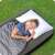 Person sleeping on a Bestway single air mattress, 188 x 99 x 25 cm, grey, outdoors