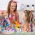 Children playing with Avenir Unicorn Craft Play Box, sewing and decorating unicorn toys