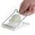 Westmark Traditionell egg slicer, stainless steel wires, white plastic base, slicing a hard-boiled egg