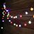 Gardlov multi-colored solar string lights illuminating a wooden fence