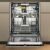 Whirlpool W8I HF58 TU fully integrated dishwasher with open door
