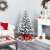 Timeless Tools 180 cm snow-frosted artificial Christmas tree in a living room setting