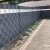 Gardlov Fence Tape, installed on a fence, anthracite color