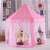 Kruzzel pink polka dot princess play tent in a child's room