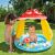 Child enjoying the Gomba mushroom baby pool with sunshade
