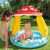 Baby playing in Gomba mushroom kiddie pool with sunshade