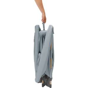Maxi-Cosi Swift Eco travel cot being folded, showing the easy one-second folding mechanism - Maxi-Cosi