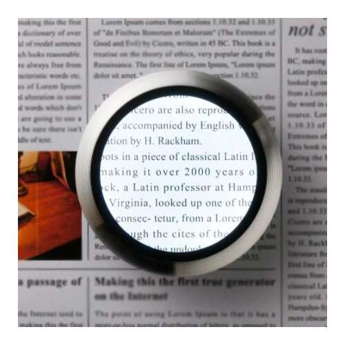 Magnifying glass with LED light, showing text through the lens, 5x magnification, portable, aluminum