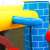 Pepita Castle XL inflatable bouncy castle with slide and ball pit, blue and red, basketball hoop detail