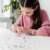 Girl making bracelets with Totum Design & Shine Sparkle Bracelets craft kit
