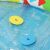 Close-up of Bestway 52378 baby pool with floating shape sorter pieces.