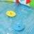 Close-up of Bestway 52378 baby pool with floating shape sorter pieces.