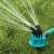 360 degree rotating sprinkler with adjustable nozzles spraying water on the lawn