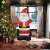 Inflatable Santa Claus Christmas decoration in a living room setting