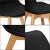 Close-up details of Springos black dining chair seat and wooden legs