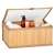 Springos bamboo storage box with lid open and filled with toiletries, showing the clear lid