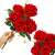 Springos artificial red rose bouquet, 6 roses, held in a hand