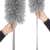 Springos telescopic duster, gray microfiber, woman holding it, close-up