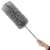 Woman holding Springos telescopic dust mop with microfiber head, gray
