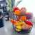 Springos 2-tier fruit basket with fruit in it, black metal, kitchen counter