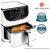 Cosori Premium white air fryer with cooked chicken inside, Red Dot Design Award winner