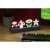 Paladone Super Mario Bros. Icons Light, a 30cm wide lamp featuring Mario, a mushroom, a flower, and a star, on a desk